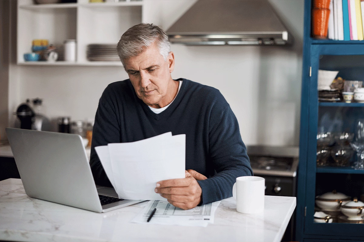 man reading papers