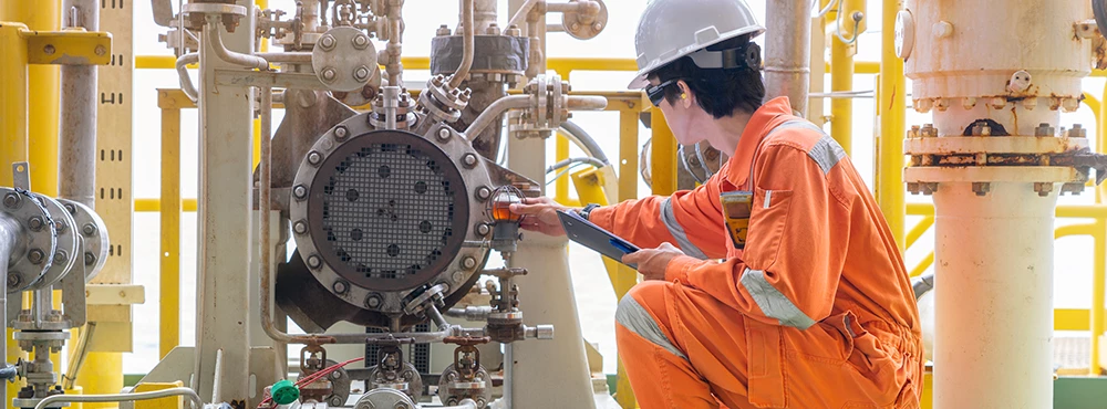 mechanical engineer fixing a production machine