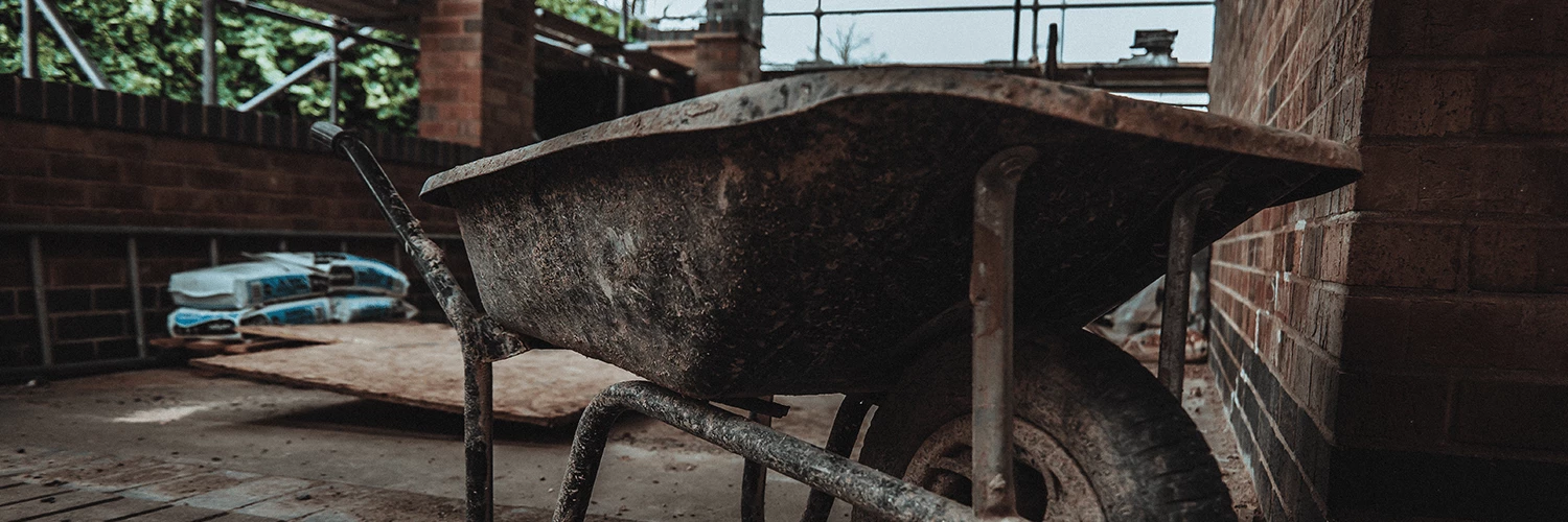 Wheelbarrow for man paving rhino trade insurance