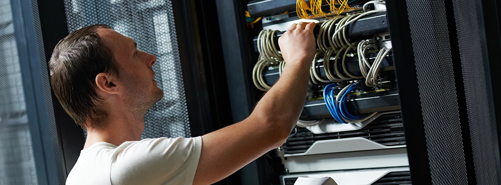 Telecommunication Engineers adjusting server cables